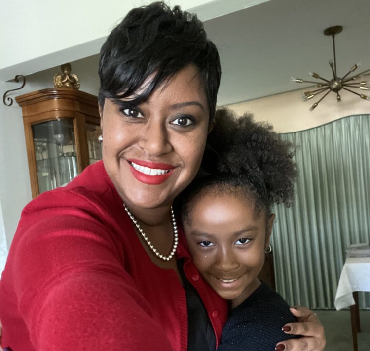 Photo of Tia Leathers, the Executive Director of Family and Community Engagement, and her daughter Taige.