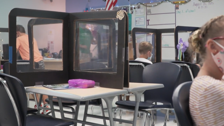 Photo of a classroom with desk shields