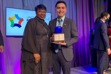 Teacher of the Year Charles Magdaluyo poses with Superintendent Dr. Diana Greene at the EDDY Awards