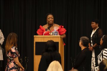 Alisha Felk at podium during School-Related Employee of the Year ceremony