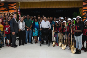 Pearson family with students from MLK Elementary and dignitaries