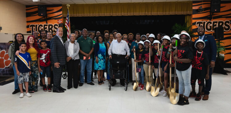 Pearson family with students from MLK Elementary and dignitaries