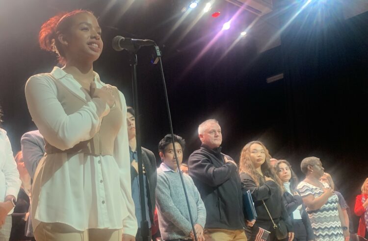 Riverside student recites the pledge at the naturalization ceremony