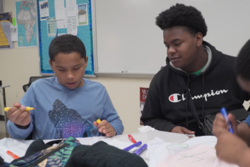 Riverside High mentor talks with his Ruth Upson Elementary mentee.