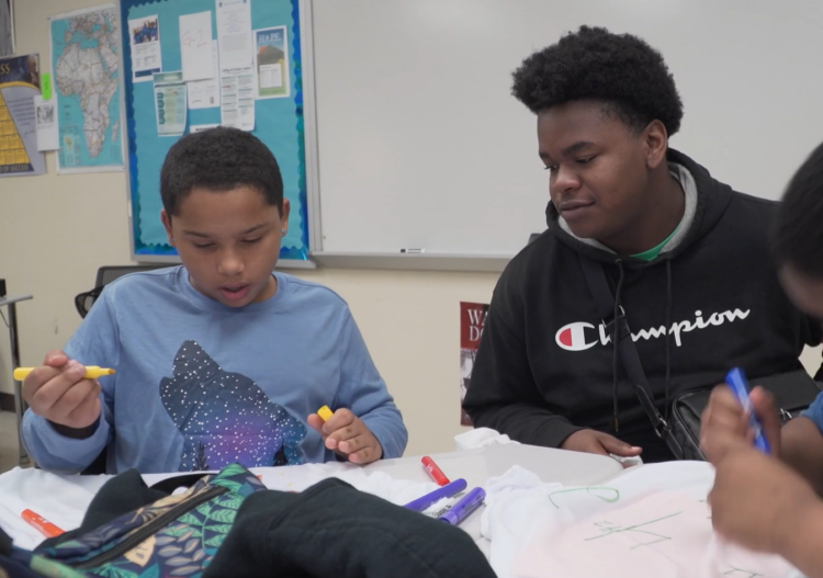 Riverside High mentor talks with his Ruth Upson Elementary mentee.