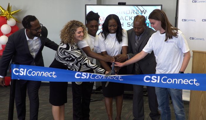 Andrew Jackson students and staff, along with CSI staff, cut the ribbon on the school's new tech lab