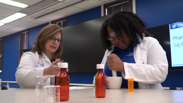 UF Health clinician working with a Paxon student