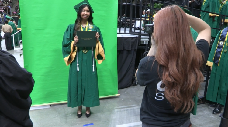 Student in a cap and gown.