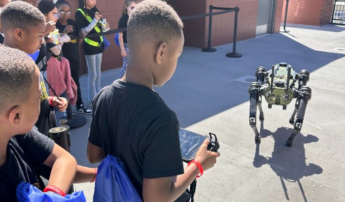 Students interact with live robot at the festival.