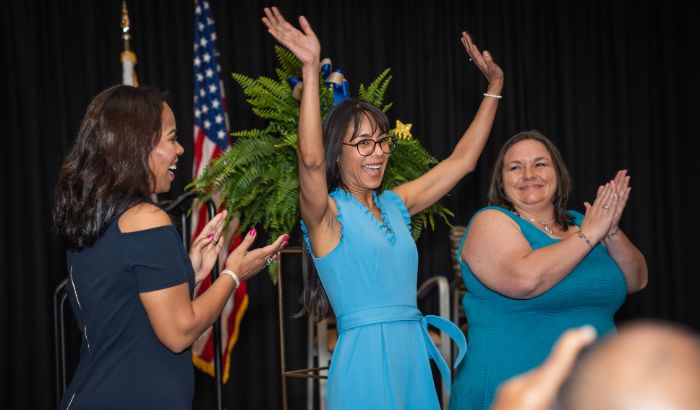 Grisel Fuentes reacts to the announcement that she is the School-Related Employee of the Year.