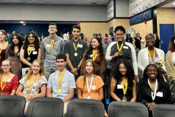 Seal of Bilteracy awardees pose with their medals.