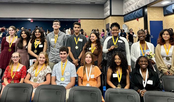 Seal of Bilteracy awardees pose with their medals.